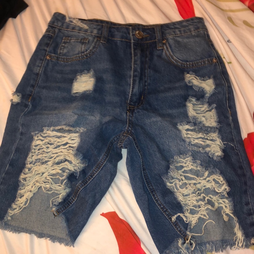 I am selling blue rip jean shorts from almost famous